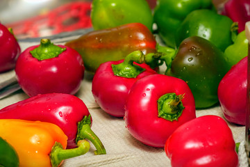 Bell peppers on a white towel in the kitchen. Selective focus
