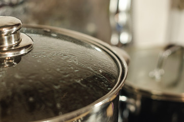Kitchen pan with lid on the stove