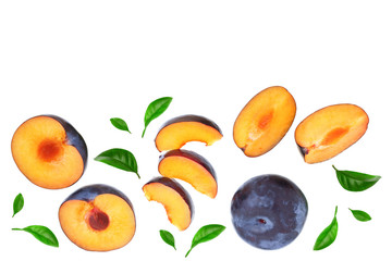 plums with leaf isolated on a white background with copy space for your text. Top view. Flat lay pattern