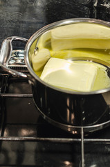 Melting butter in the pan on the stove 