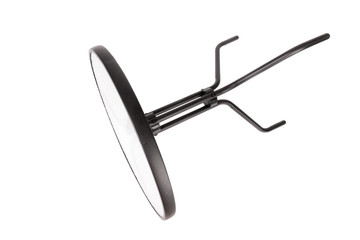 Metal/iron table isolated on white background. Glass dining table. Garden furniture. Side view. Metal table fell and lying on the ground. Overturned