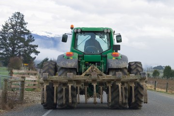 A Tractor been driven on a New Zealand rural road