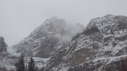 Pair of rugged mountain peaks in stormy conditions