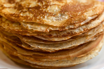 Thin pancakes with crispy crust. Maslenitsa. Pancakes for breakfast and carnival.