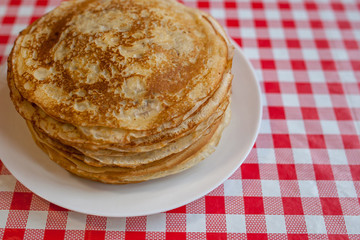 Thin pancakes with crispy crust. Maslenitsa. Pancakes for breakfast and carnival.