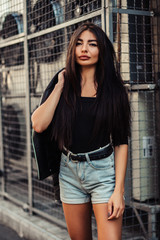 Naklejka premium Pretty young sexy fashion woman posing on ventilators background.