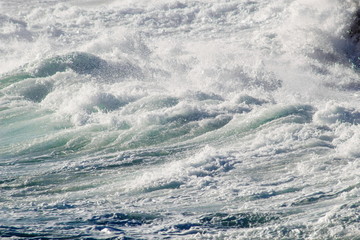 Naklejka na ściany i meble background image of waves crashing in the sea