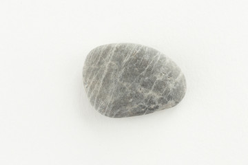 Sea pebble on a white background