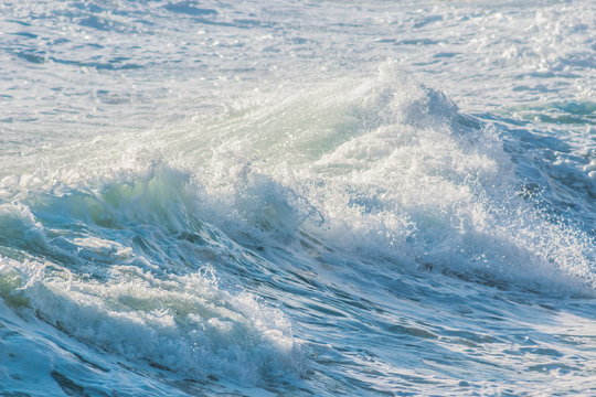background image of waves crashing in the sea