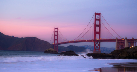 Sunset over the Golden Gate Bridge at Baker Beach in San Francisco, California