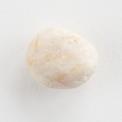 Fototapeta na wymiar Sea pebble on a white background