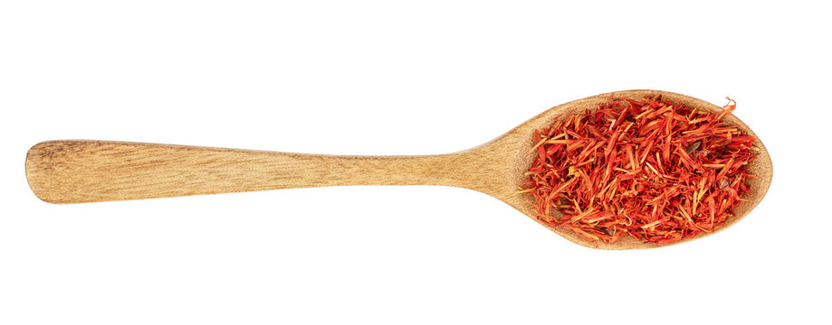 Heap Of Saffron In Wooden Spoon Isolated On White Background. Top View. Flat Lay