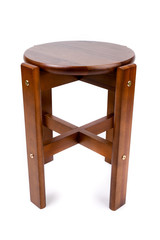 Wooden chair/stool isolated on white background. Dark brown wooden pine dining stool. Natural, solid wood bench. Side view.