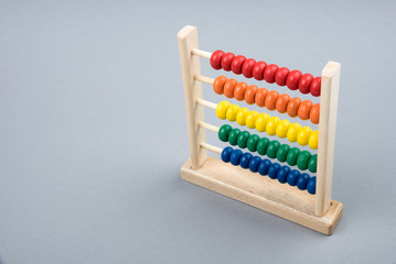 Wooden abacus or abakan. Educational toy for children. Counting frame examples, great for business concepts. Multicolored wooden abacus. Front view. Place for text. Copy space, 