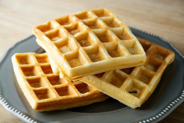 Belgium waffles close up. Homemade breakfast, delcious dessert for children.