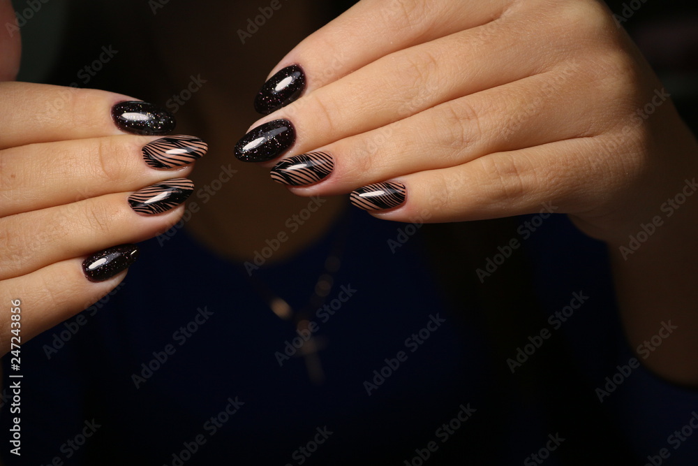 Wall mural Stylish manicure nails on a beautiful textural background