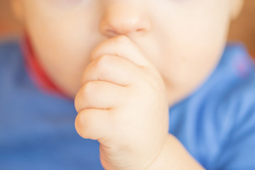 Young baby sucking his thumb