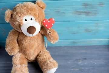 Toy bear with a heart. The basis for the greeting card. Preparation for a romantic card with bears and hearts. Valentine card
