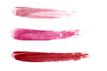 Sparkling nail polish strokes isolated on white.