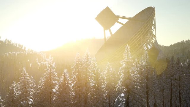 The observatory radio telescope in forest at sunset