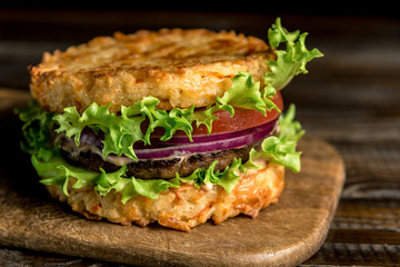 Healthy lifestyle, proper nutrition. Healthy rice burger with vegetables, herbs and cutlet