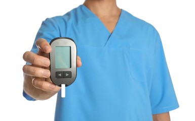 Male doctor holding glucose meter on white background, closeup. Medical object