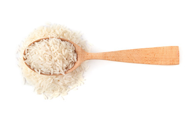 Spoon and uncooked long grain rice on white background, top view