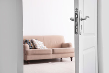 Room interior with new furniture, view through open door