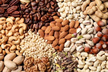 Fotobehang Organic mixed nuts as background, top view © New Africa
