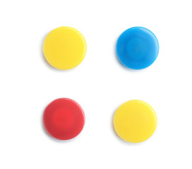 Bright magnets on white background, top view