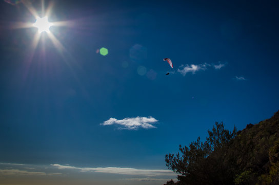 A paraplan in a blue sky
