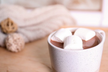 Fototapeta na wymiar Cup of aromatic cacao with marshmallows on blurred background, closeup. Space for text
