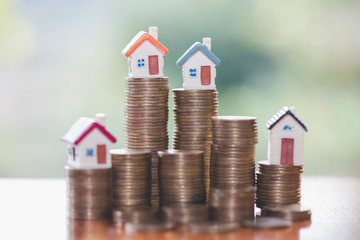 Mini house on stack of coins, Real estate investment, Save money with stack coin, Business growth investment and financial, Mortgage concept.