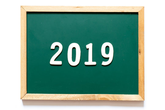 Green blackboard and wood frame with word 2019 on white background
