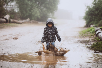 Naklejka premium Playing in the Rain