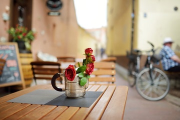 Outdoor restaurant table beautifully decorated with plants and flowers in Vilnius, Lithuania