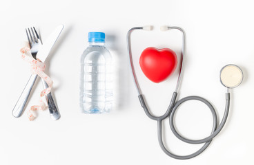 water and stethoscope with red heart isolated