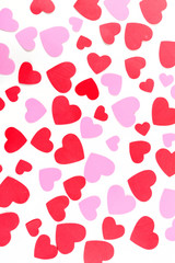 Multicolored red white and pink valentine heart shapes isolated over white