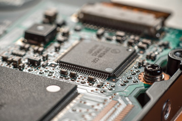 Computer chip on green motherboard close up. Computer technology concept