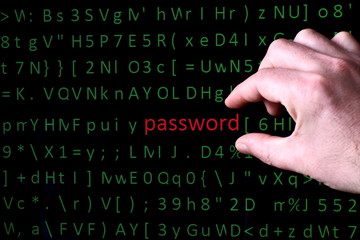 fingers of the person allocate on the screen of the pc  monitor a line with the word password printed in red font among chaotic set of computer green symbols