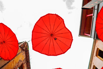 red heart umbrellas under the sky  street decoration