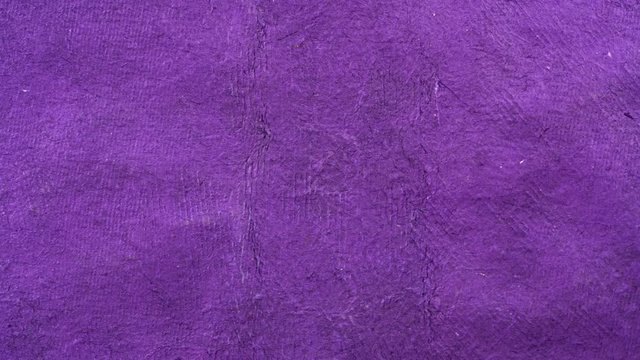 violet textured handmade paper background - horizontal pan over Huun paper created by Mayan artisans in Mexico from a tree bark