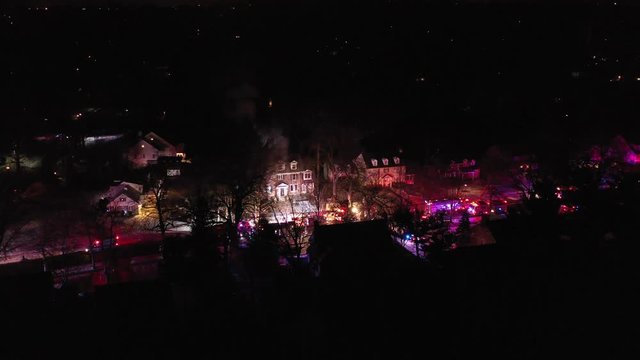 Aerial View of Fire Trucks and Apparatus on Scene of House Fire