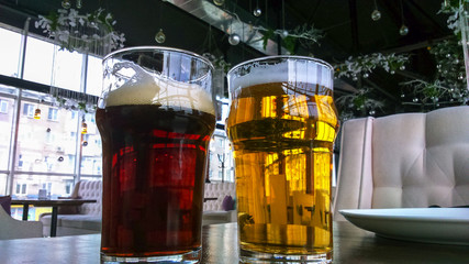 two glasses of delicious beer, dark and light