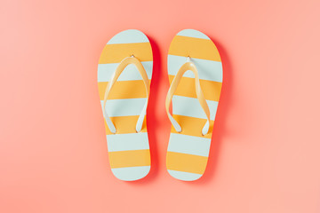 Flip flops on pink background