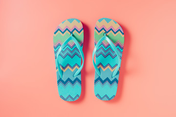 Flip flops on pink background