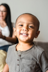 Little boy with bald head smiling portrait