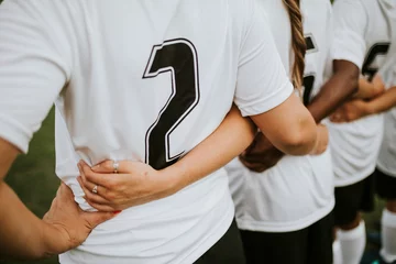 Outdoor kussens Close up of female football players huddling © Rawpixel.com