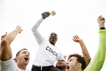 Football players celebrating their victory