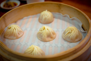 The famous steamed pork xiao long bao - soup dumplings at Ding Tai Fung restaurant.